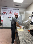 Jimmy Hassan preparing meals for Project Red Rose
